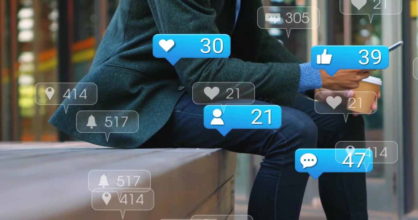 Man sitting on bench holding cup and tapping phone, causing social media counters rising around lap