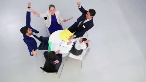 businesspeople discussing during meeting in office