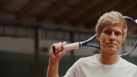 young tennis player in indoor court