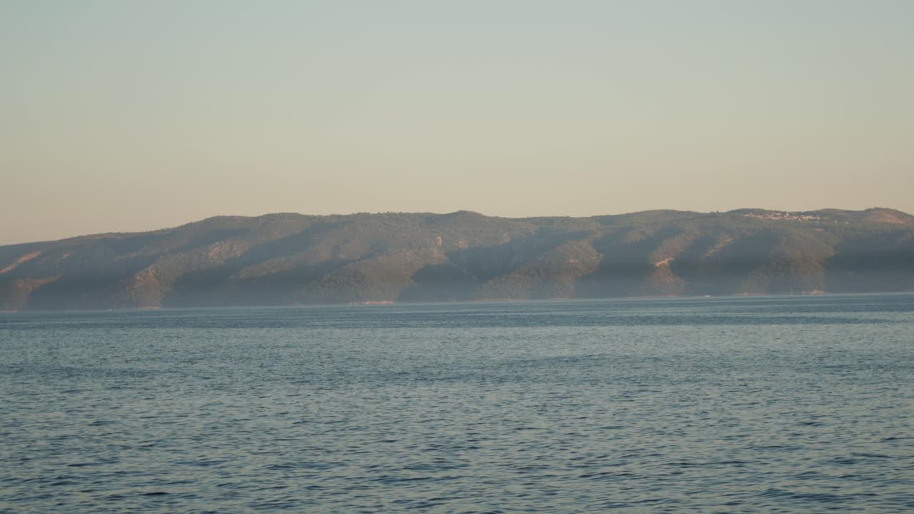 Tranquil Seascape with Distant Mountains