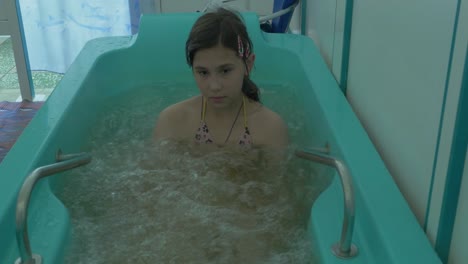 girl in a therapeutic spa bath