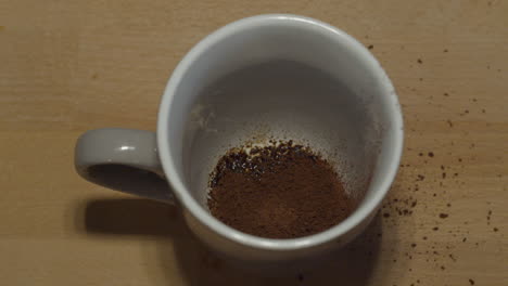 top down shot of cup of instant coffee being prepared