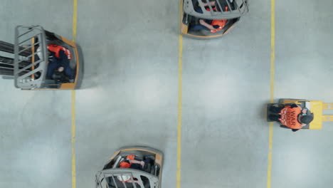 a group of people ride forklifts in all different directions in a warehouse