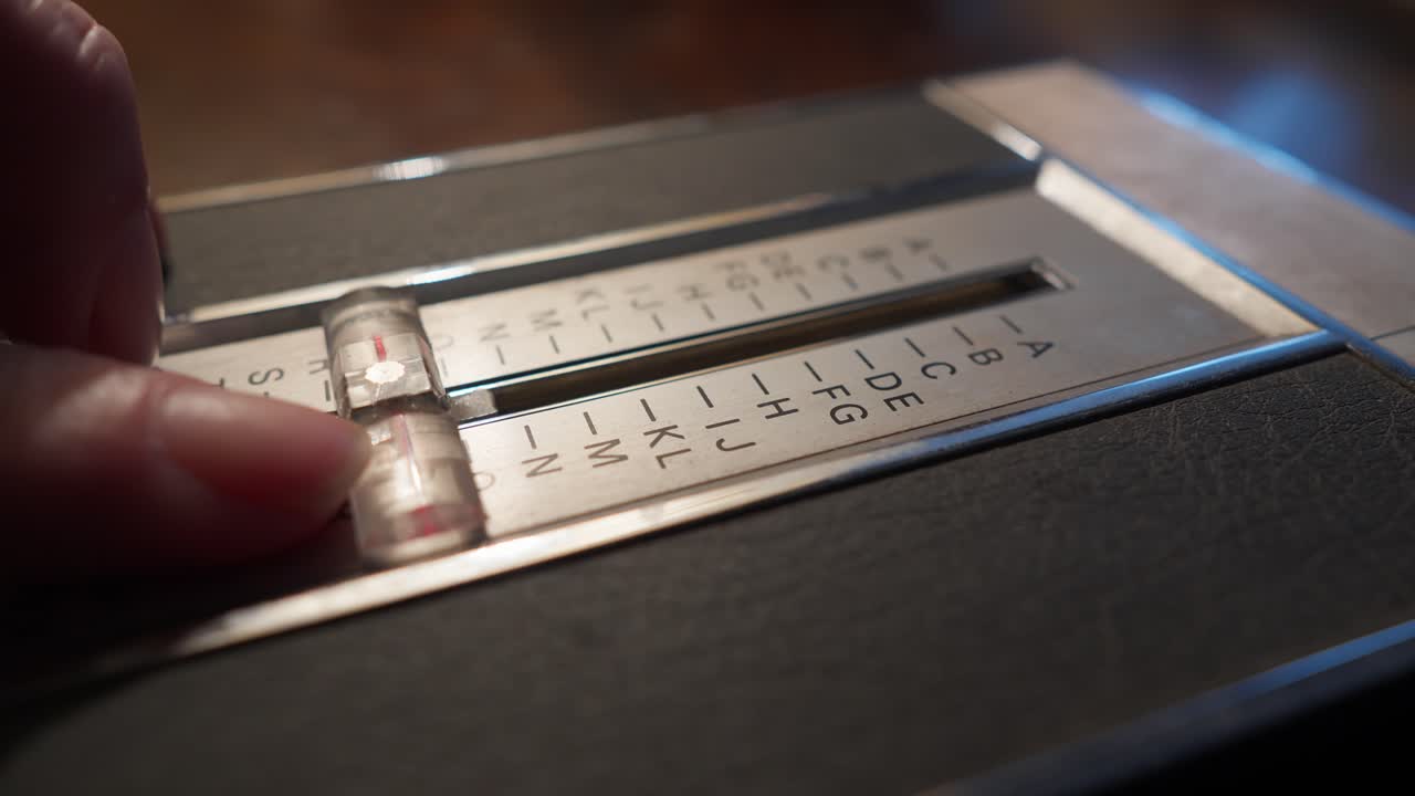 User moves alphabetical slider on retro flip up telephone contact list