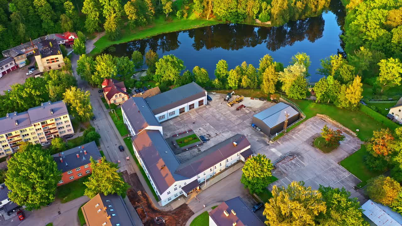 Industrial Buildings and Apartments Along Lake in Smiltene, Latvia
