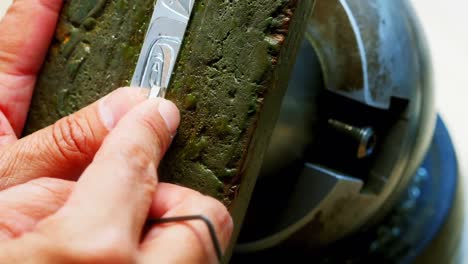 hands of craftswoman working in workshop