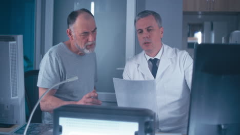 doctor reviewing x-rays with patient