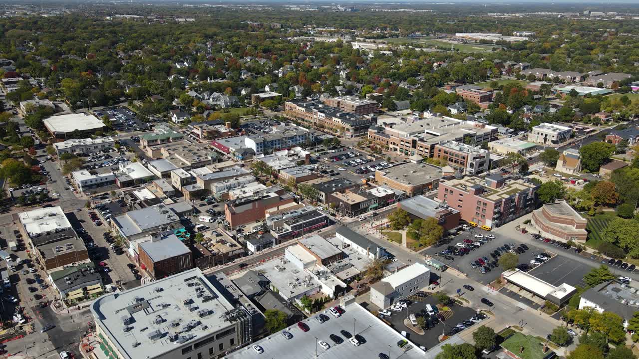 Naperville, IL, a Chicago suburb, on a sunny fall day, featuring buildings, streets. Crane Up Right Day NW