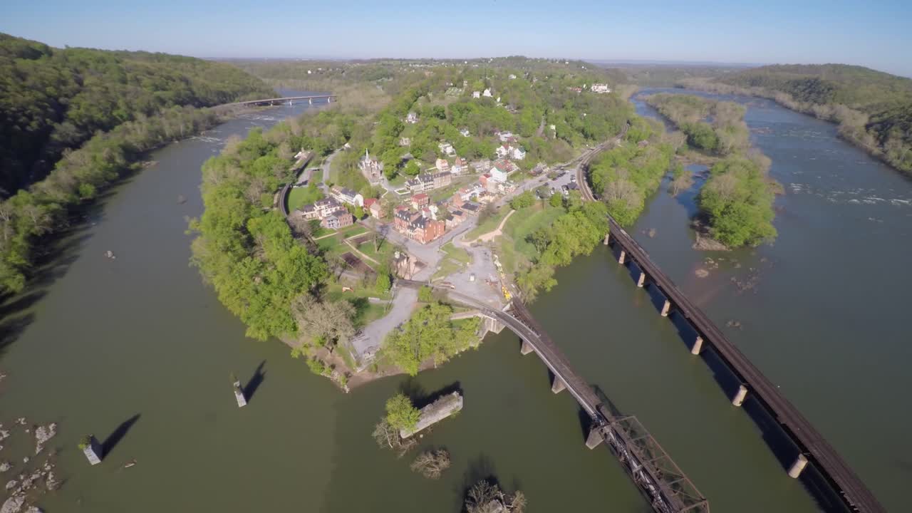 Aerial views of historic Harpers Ferry National Park in Harpers Ferry, West Virginia. Camera pulling away.