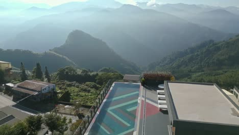 aerial view of luxury hotel in the morning overlooking the infinity pool and alishan mountains