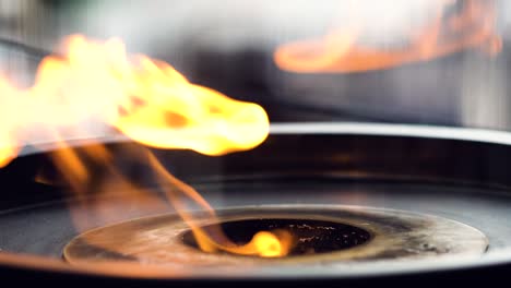 flames coming out from an industrial gas stove in a restaurant, close up 4k