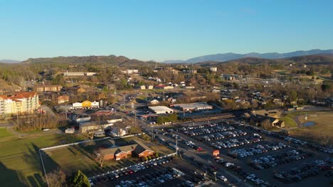 static aerial shot of piegon forge, tn at sunset.