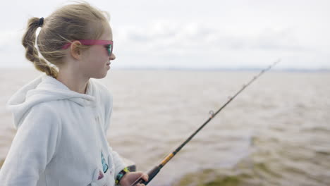 girl fishing on a lake