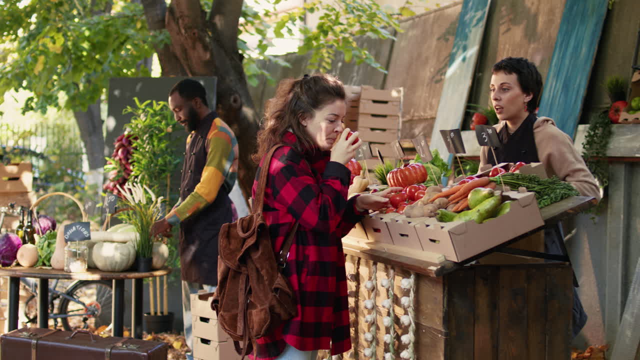 Customers shopping for fresh produce at a farmers market