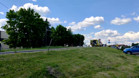 Far-away-view-of-Norwegian-police,-paramedics,-and-firefighters-helping-people-on-car-crash-in-Skedsmo-Skjetten-in-Norway