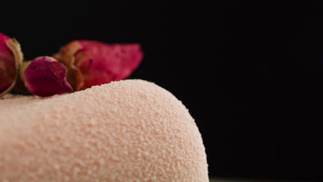 pink cake with dried roses