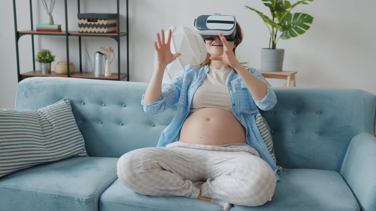 Pregnant Woman Experiencing Virtual Reality on a Couch