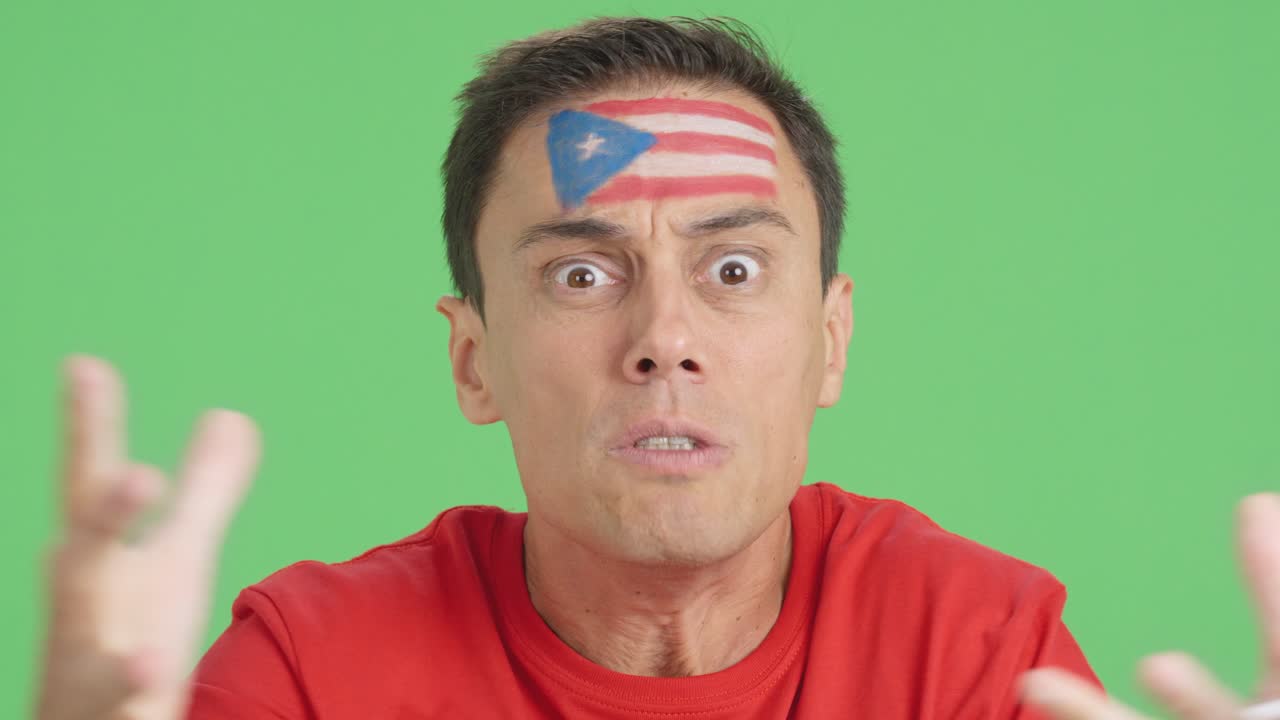 Man with puerto rican national flag upset with a referee
