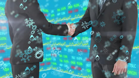 covid-19 icons over two businessman shaking hands against stock market data processing