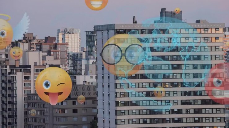 Globo giratório e vários ícones de emoji de rosto flutuando contra edifícios altos ao fundo.