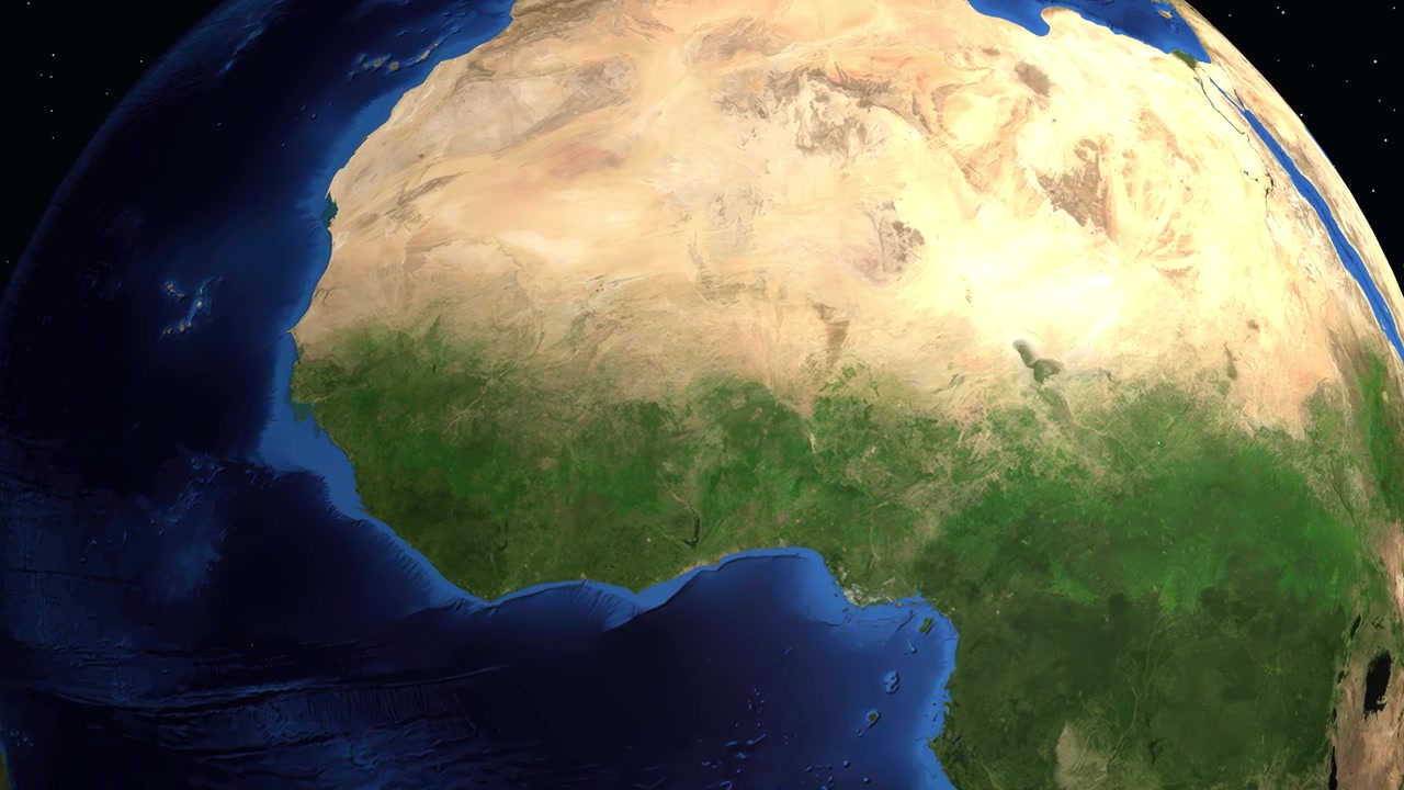 Un globo 3D rotante zooma sull'Africa occidentale, evidenziando Fada N'Gourma con una sovrapposizione di informazioni.