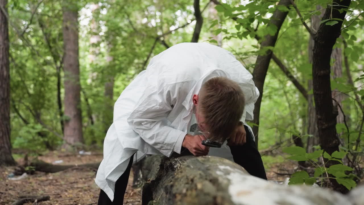 Scientific researcher in white lab coat bending over fallen stump using microscope for close observation in dense forest, studying natural growth and conducting ecological research outdoors