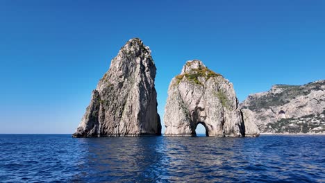 faraglioni at capri in naples italy. island landscape. tourism landmark. faraglioni at capri in naples italy. bay of naples skyline. cultural heritage coastal. paradise capri island.