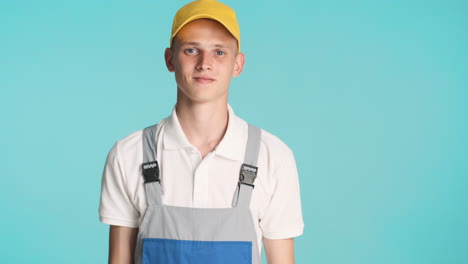 builder with grey uniform and yellow cap