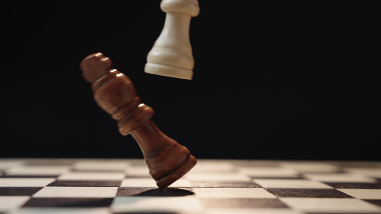 Cinematic chess scene with circular camera movement as one king enters and knocks down another representing business competition leadership change takeover strategy and power transition concept