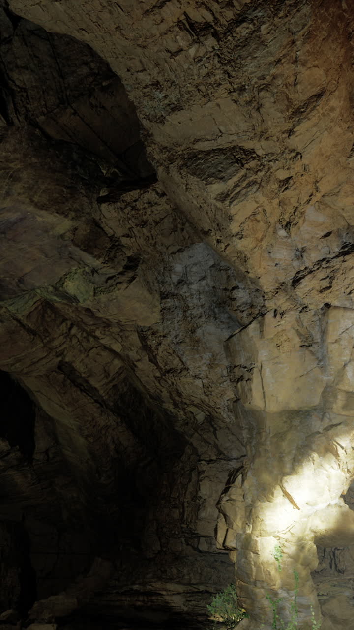 Exploring a vast underground cave with stunning rock formations at dusk