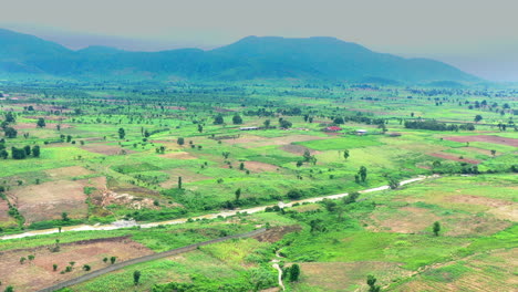 nigeria's countryside fertile farming estate lands - aerial panorama