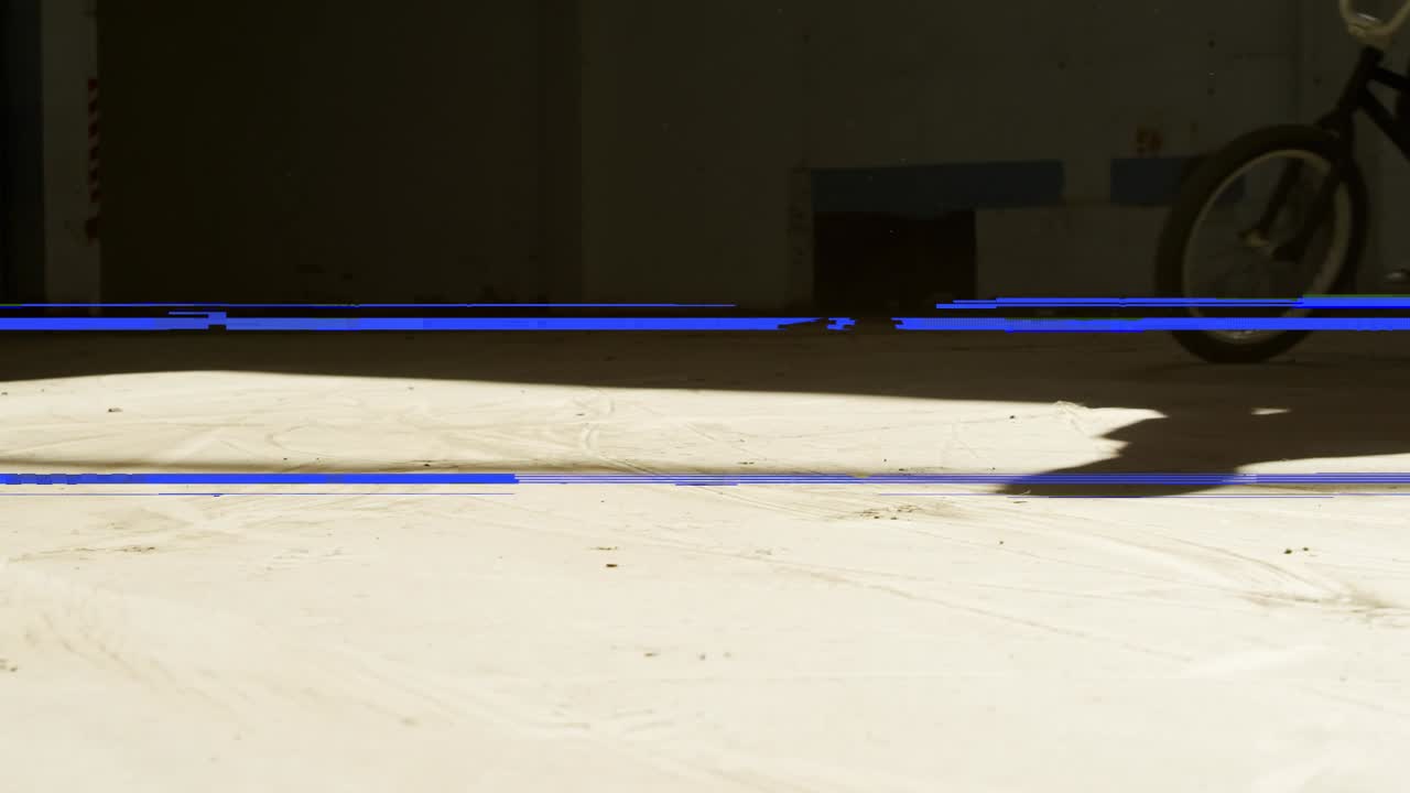 Dynamic BMX Rider Performing Stunts with Glitch Effects
