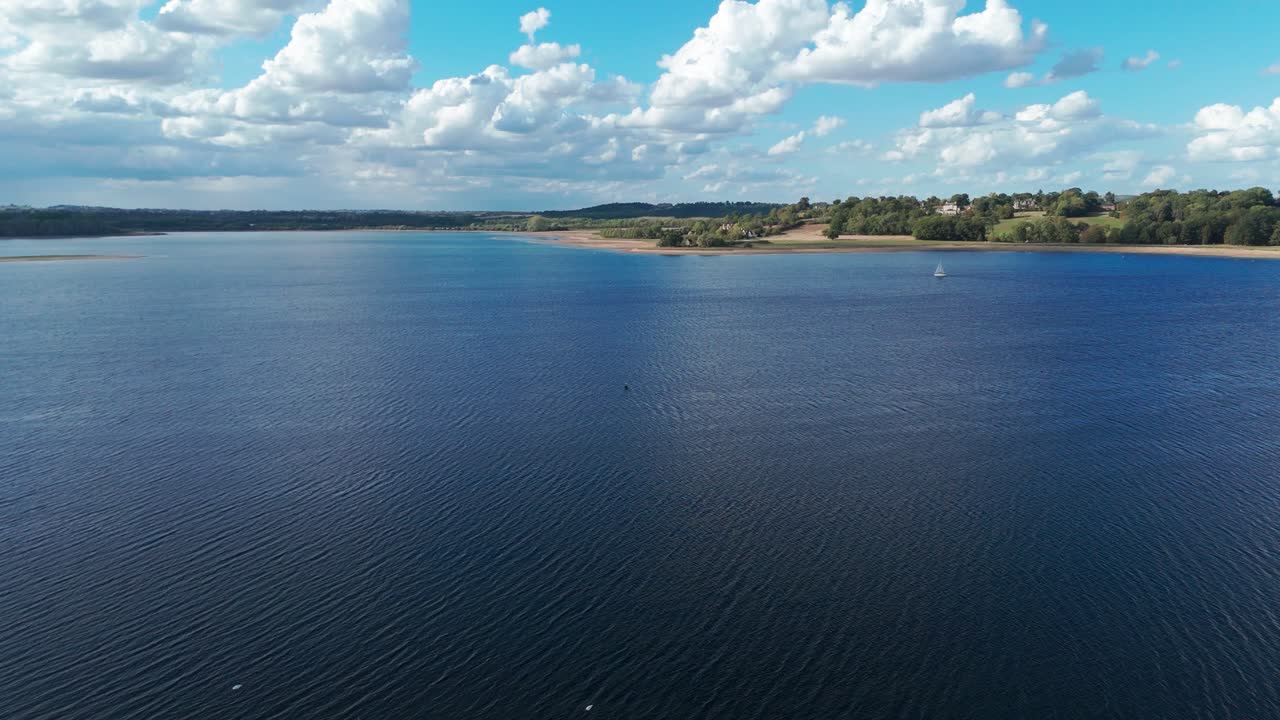 Calm Rutland Water under cloudy sky near Oakham, UK, evoking tranquility