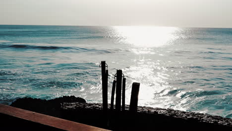 sitting by the ocean a few hours before sunset in asia