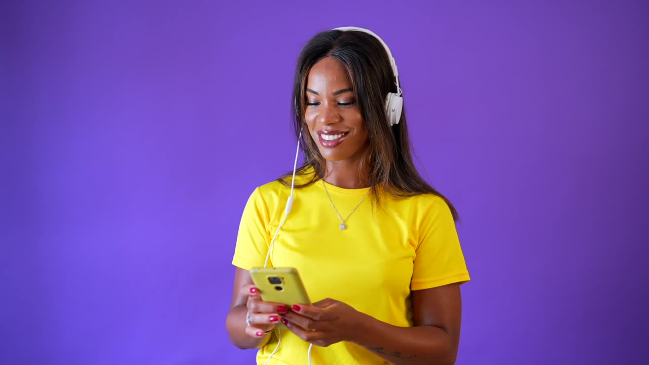 Woman enjoying music with headphones and phone