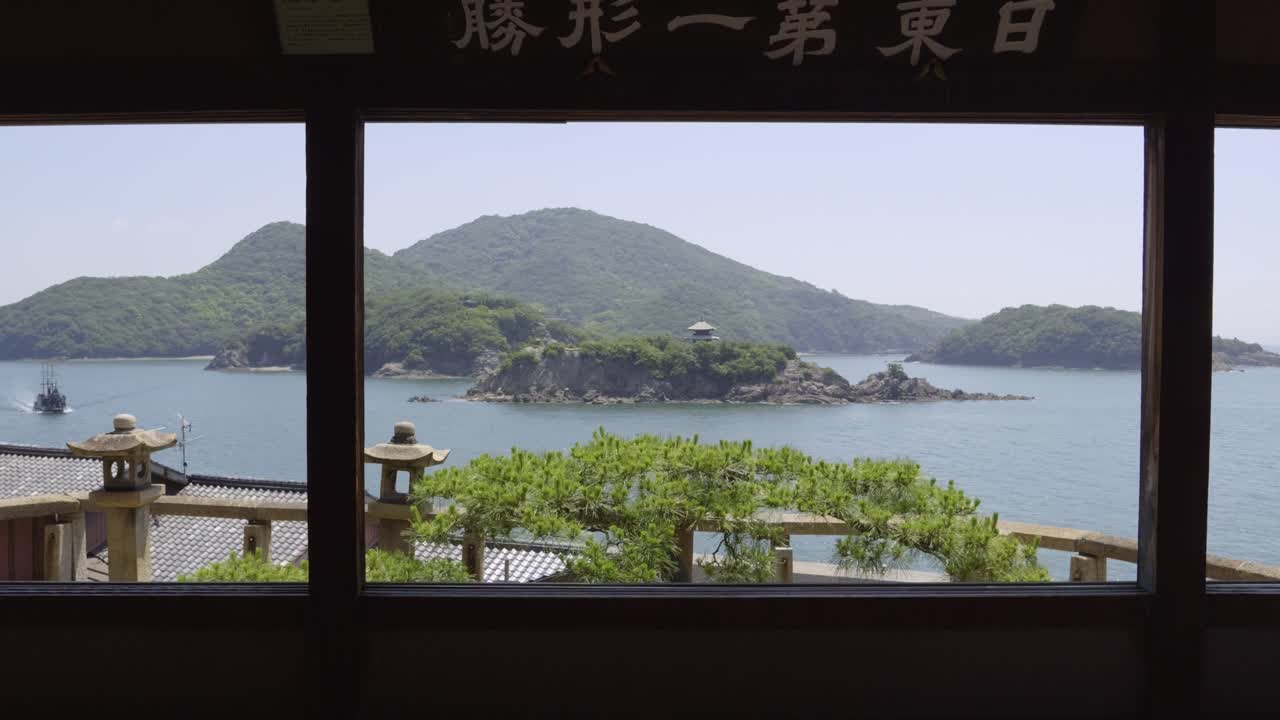 Slow motion dolly in at Fukuzenji Temple in Japan looking out on island scenery