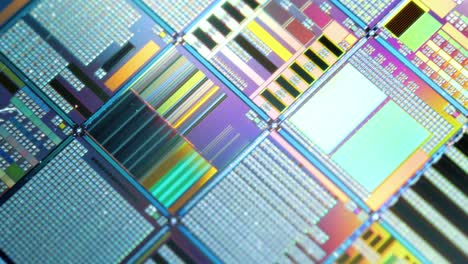 Silicon-semiconductor-wafer-close-up.-In-electronics,-a-wafer-also-called-a-slice-or-substrate-is-a-thin-slice-of-semiconductor,-a-crystalline-silicon,-used-for-the-fabrication-of-integrated-circuits