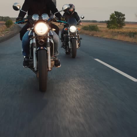 a group of bikers rides along the highway in a row 4