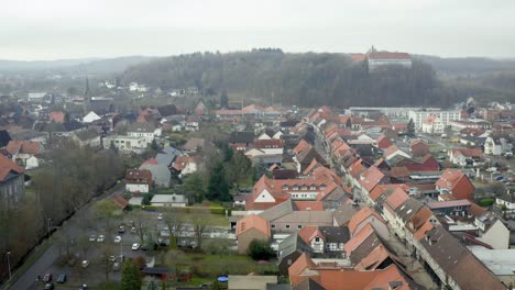 drone aerial view of the traditional german village herzberg am harz in the famous national park in central germany on a cloudy day in winter.