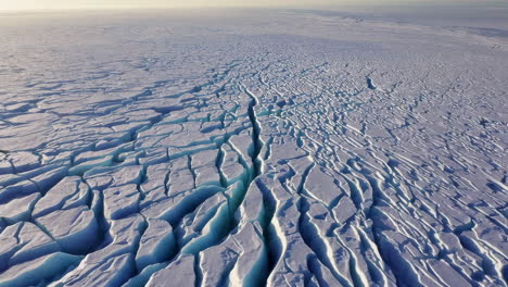 aerial view of a fractured ice sheet or glacier