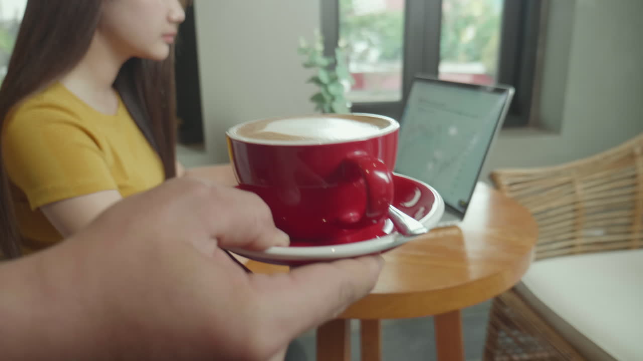 Woman and man working in a cafe