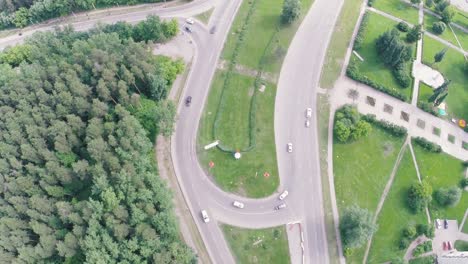 aerial view of city intersection with roundabout and park