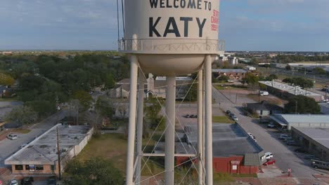 Establishing-aerial-shot-of-large-water-tank-in-downtown-Katy,-Texas-just-outside-of-Houston