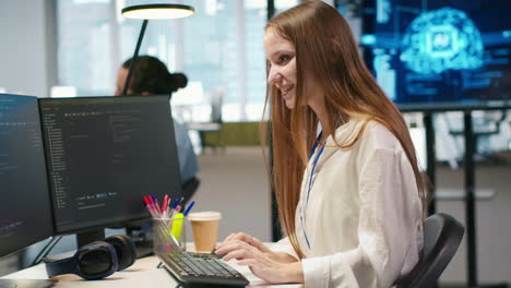 young female programmer uses computer to write code, developing machine learning