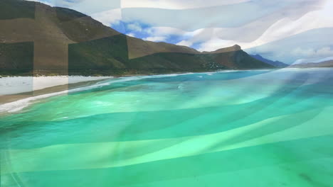 digital composition of greece flag waving against aerial view of waves in the sea