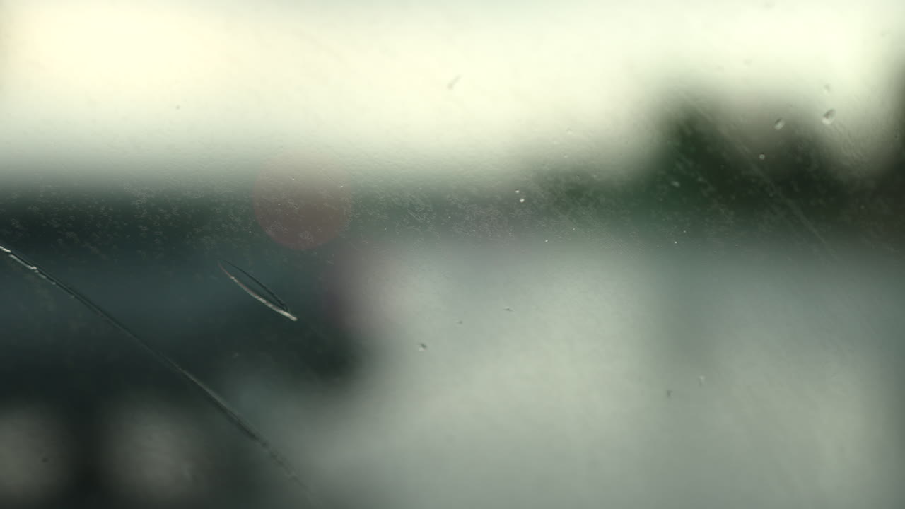 Windshield Of A Car Window Wet By The Raindrop