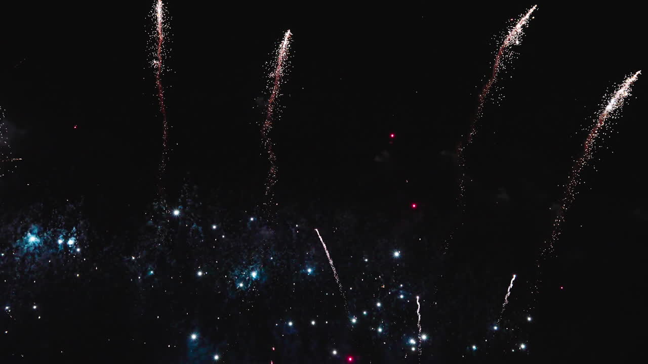 Radiant fireworks lighting the dark sky with brilliant color flashes