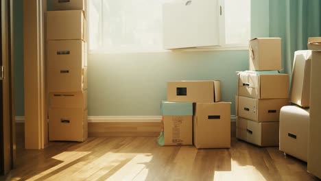 man and woman moving boxes into new apartment