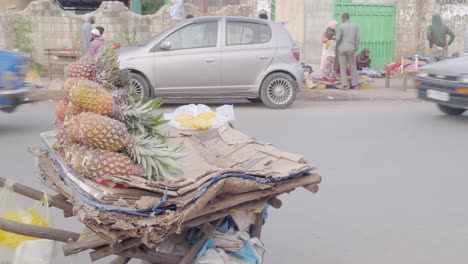 this guy is selling fresh local grown pineapple in the street of piassa, addis ababa