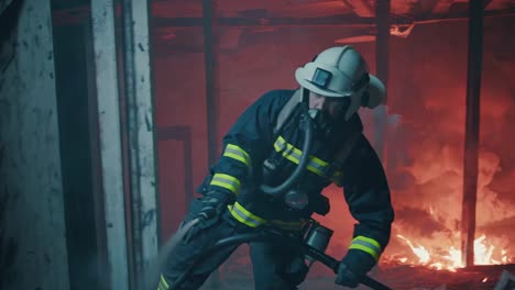 firefighter battling a house fire